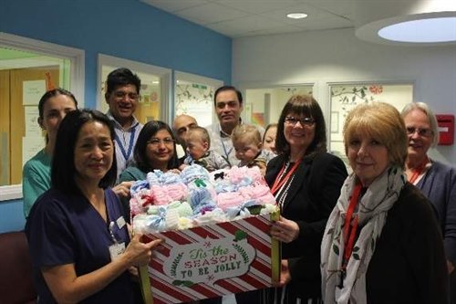 Mercury Mall breakfast club knitters donate hats and blankets to Queen's Hospital